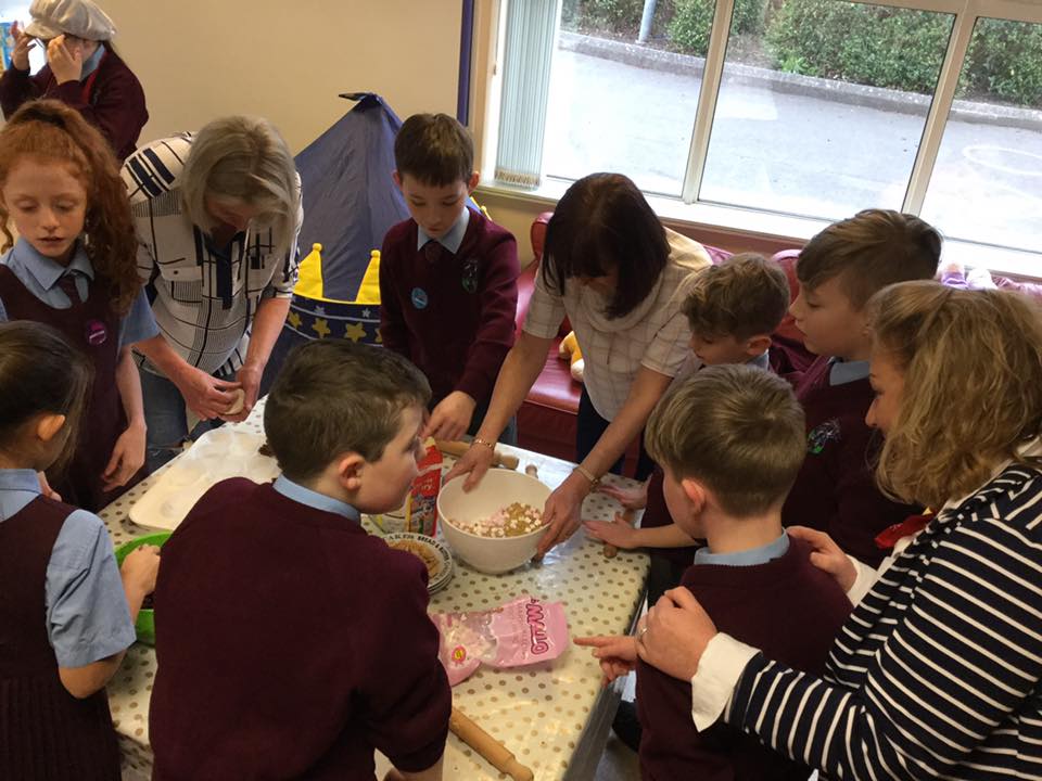 Fairtrade Committee baking buns with mums and Mrs McGranaghan