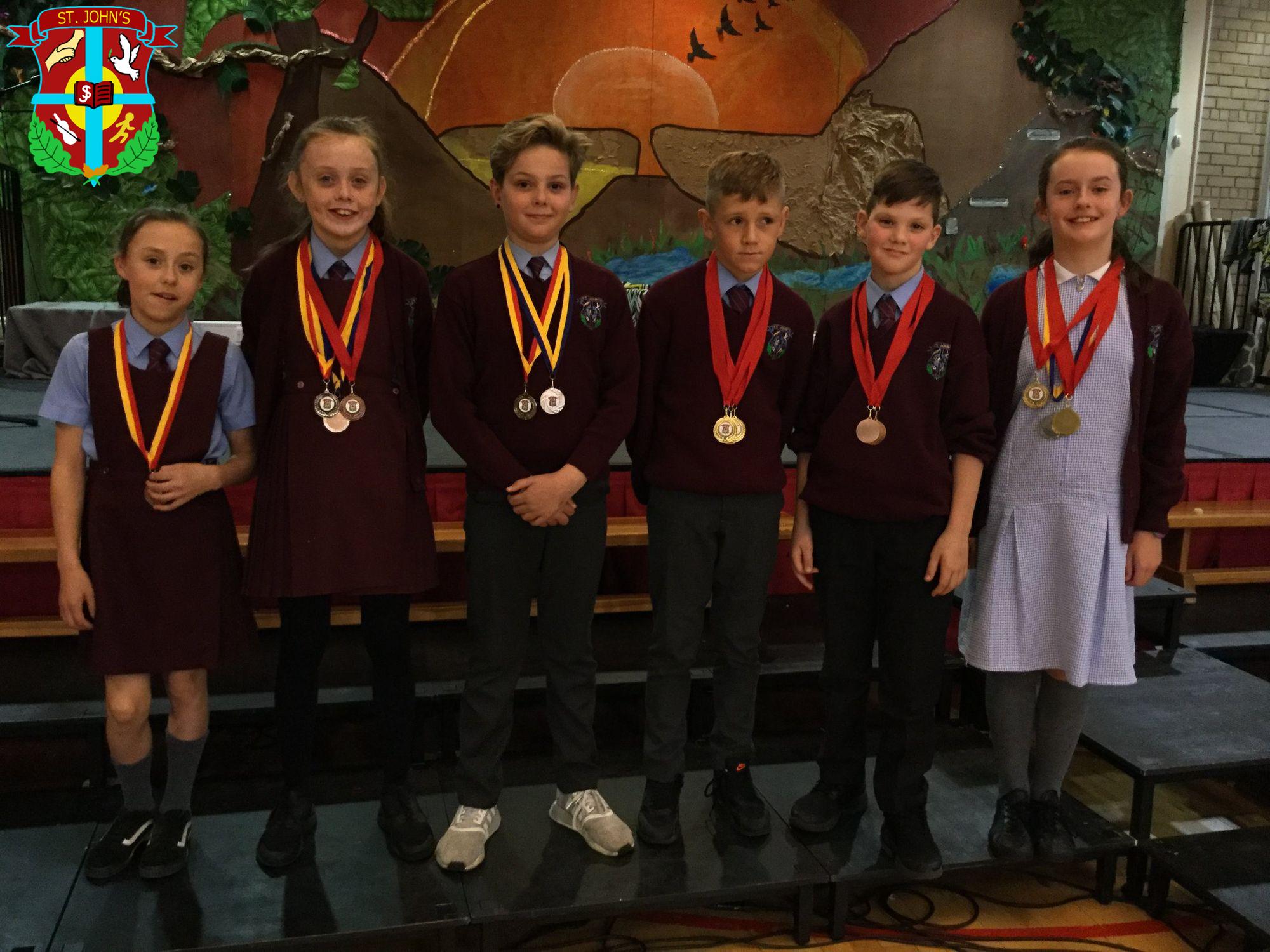 Year 7 children receiving medals for sports day. Well done everyone!