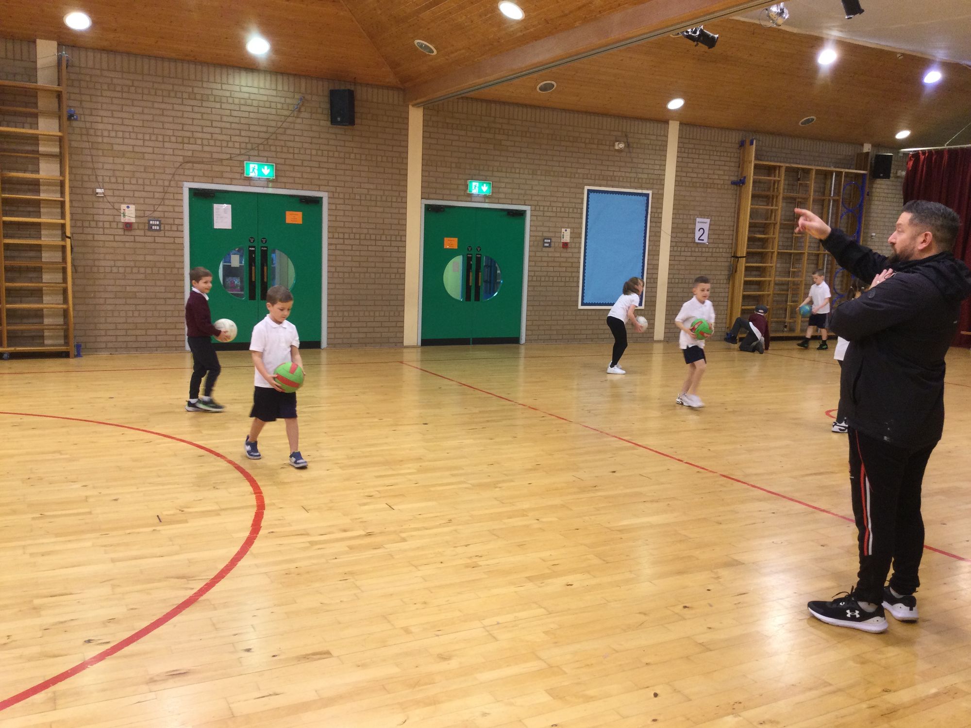 Year 4A enjoying their Gaelic football coaching with Sean Dolan’s Brian .