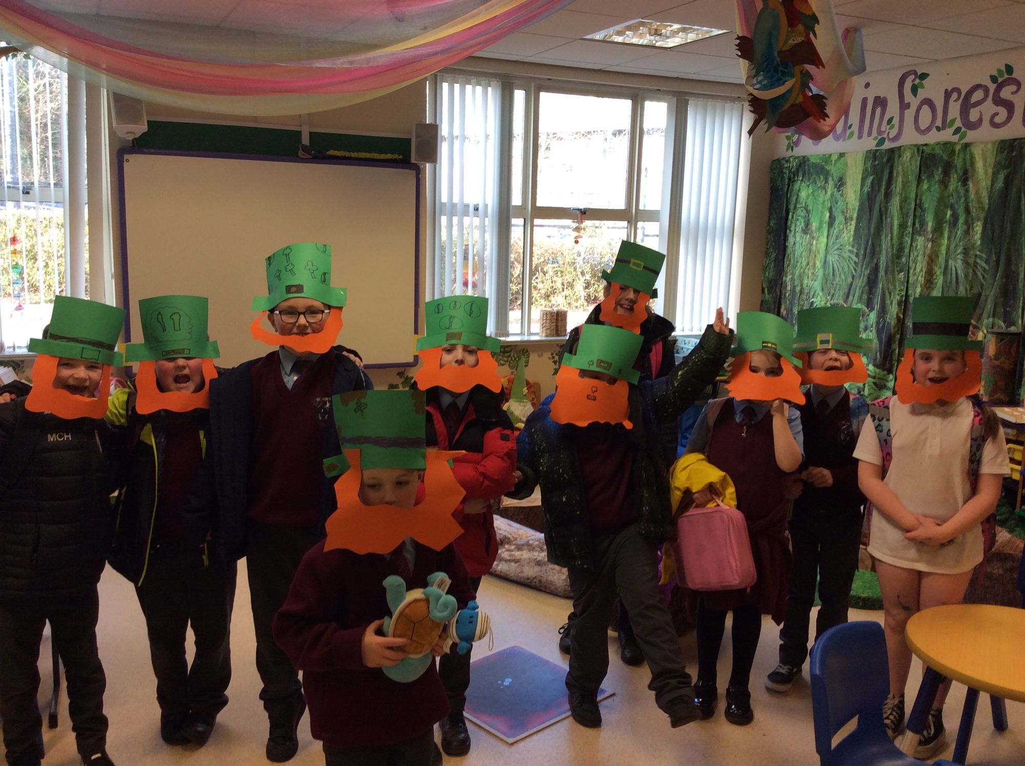 Making St Patrick's Day masks in after-school art club