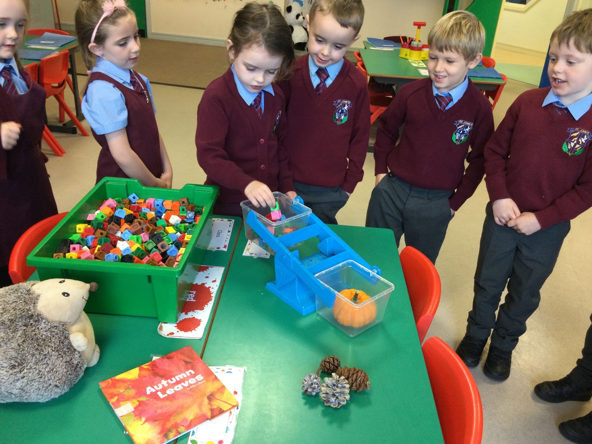 Year 2 were using scales to weigh autumn items. We