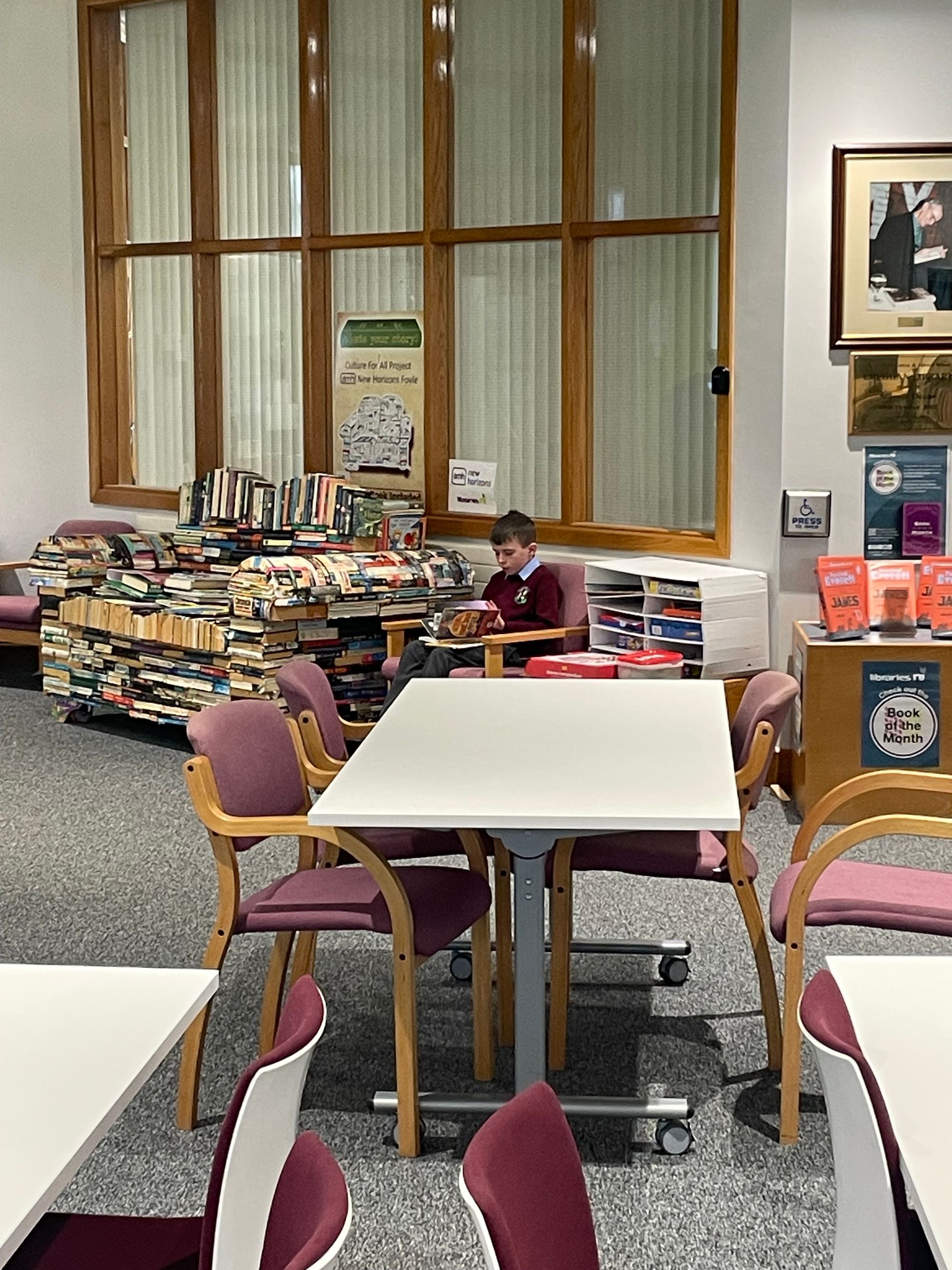 Year 4B enjoying some quiet reading time in Creggan library
